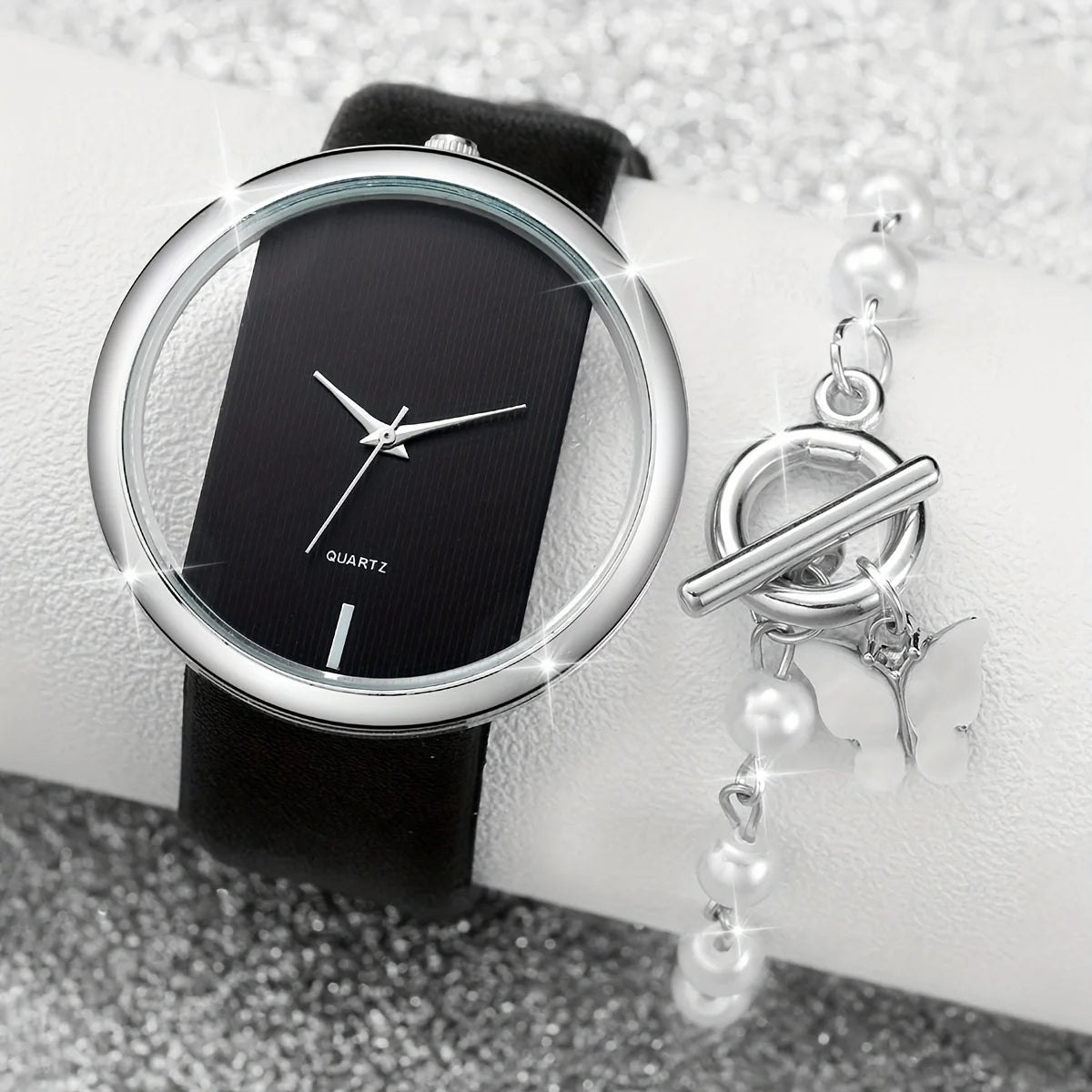 Papillon noir et blanc, montre pour femme